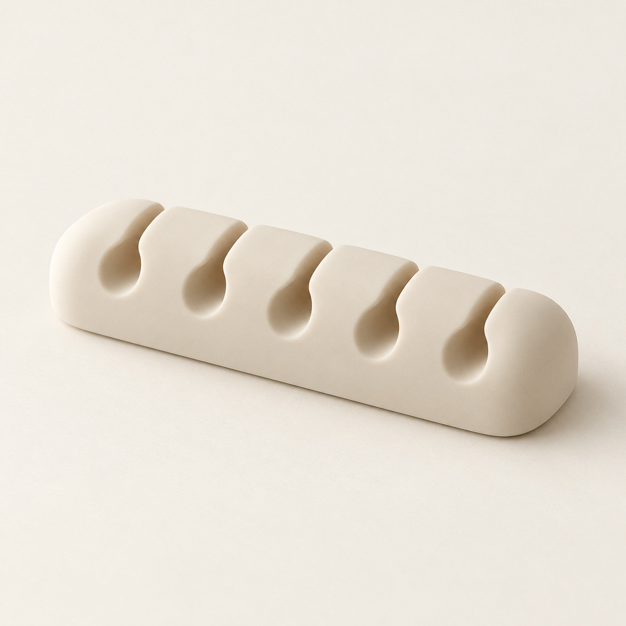 AI-generated concept image: five-slot cable organizer on a warm ivory studio background.